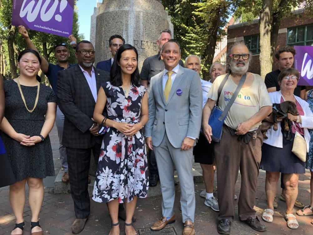 Boston City Councilor Michelle Wu with State Representative Aaron Michlewitz and other supporters. (Anthony Brooks/WBUR)