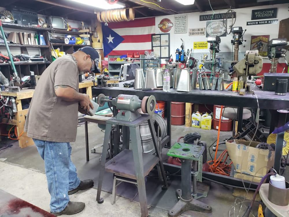 Ulisis Santiago in his workshop. (Maayan Silver)