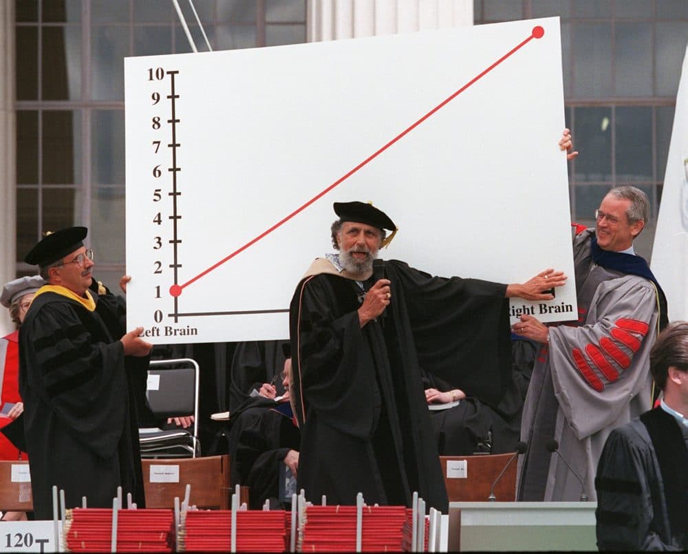 Ray, left, and Tom Magliozzi, center, hosts of NPR's "Car Talk," get some assistance from then-MIT President Dr. Charles Vest, right, while explaining their theory of happiness during commencement at MIT on June 4, 1999. The Magliozzi brothers are alumni of the university. (Pam Berry/The Boston Globe via Getty Images)