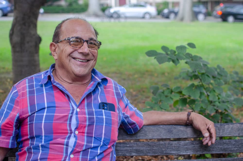 Ray Magliozzi sits on a park bench to discuss the end of the broadcast "Car Talk" on the radio.  (Sharon Brody / WBUR)