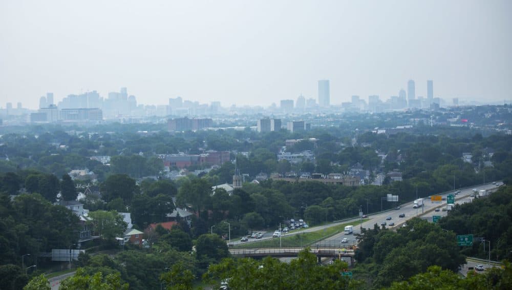 A view of the Boston skyline on July 21, 2021 when haze from the wildfires out West covered the city. (Jesse Costa/WBUR)