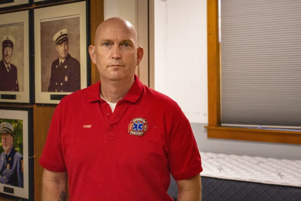 Fire Chief Alex Schaeffer stands in front of recently-constructed bunk rooms in the Edgartown Fire Station, built so firefighters commuting from out of town or off-island can have a place to sleep during their shifts. (Wilder Fleming/WBUR)