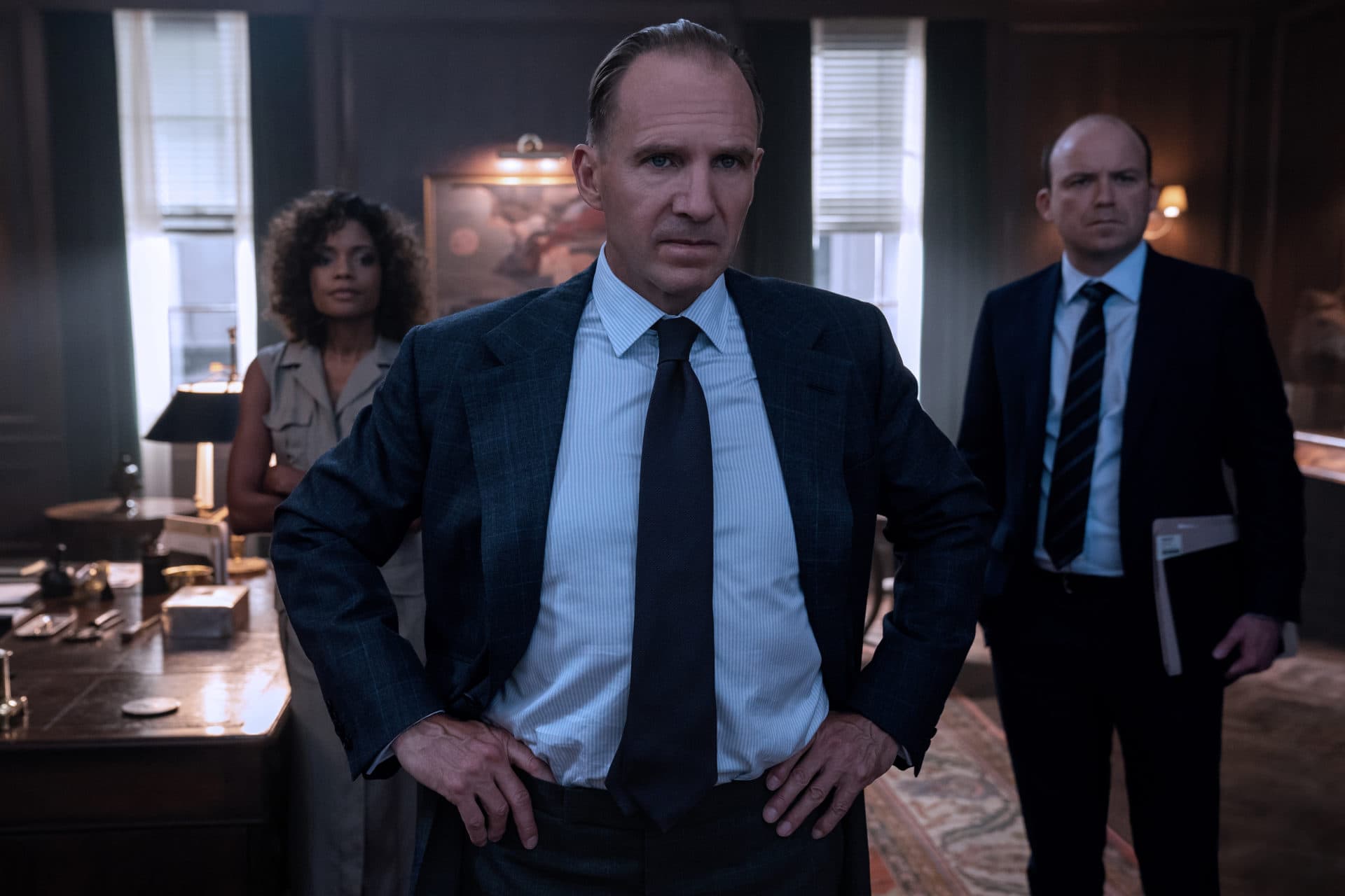 Ralph Fiennes as M, Naomie Harris as Moneypenny and Rory Kinnear as Tanner in "No Time to Die." (Courtesy Nicola Dove/MGM)