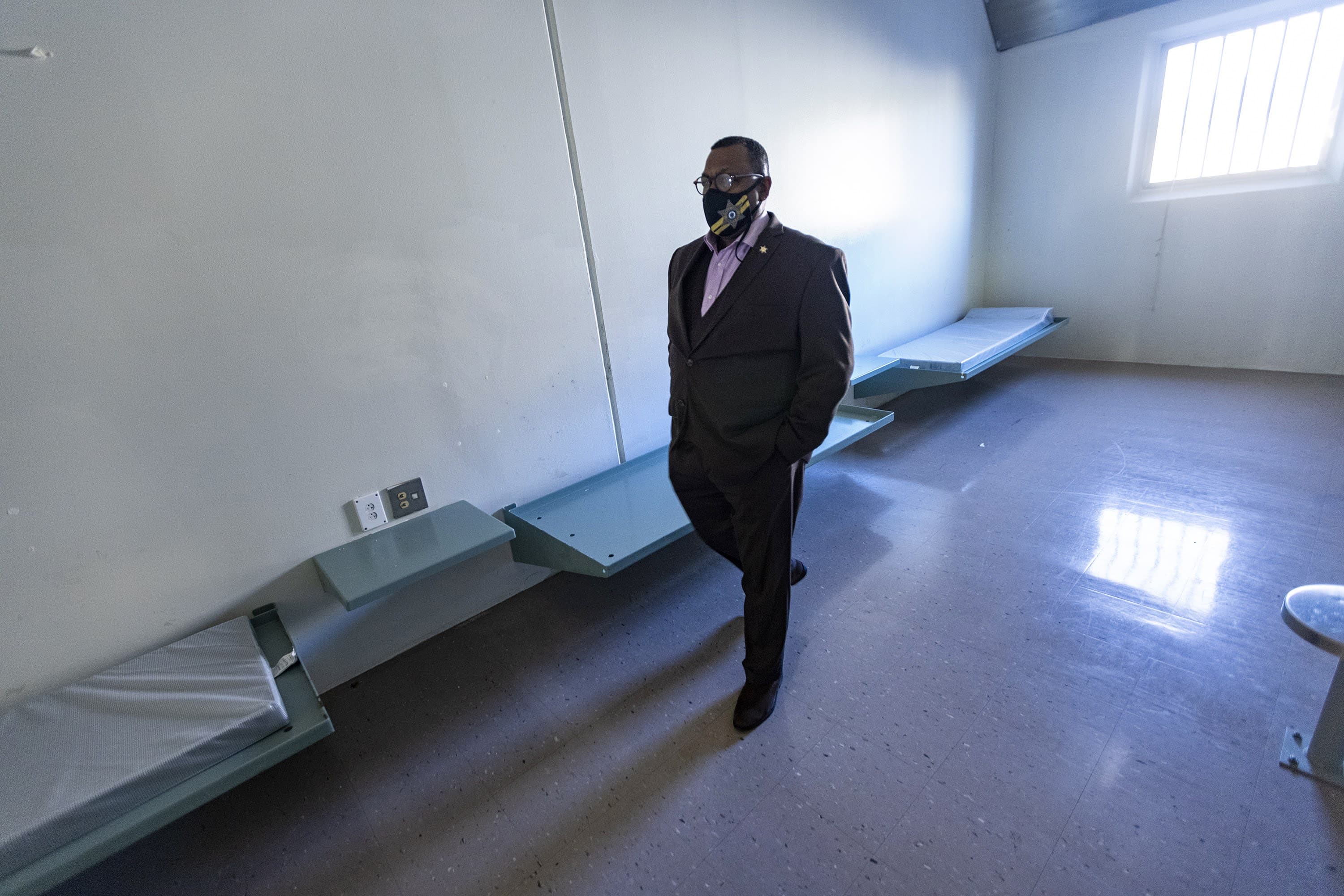 Sheriff Steven Tompkins walks through one of the jail cells he says will be turned into a room that will house some people without homes who live in tents around Boston's so-called "Mass. and Cass" area. (Jesse Costa/WBUR)