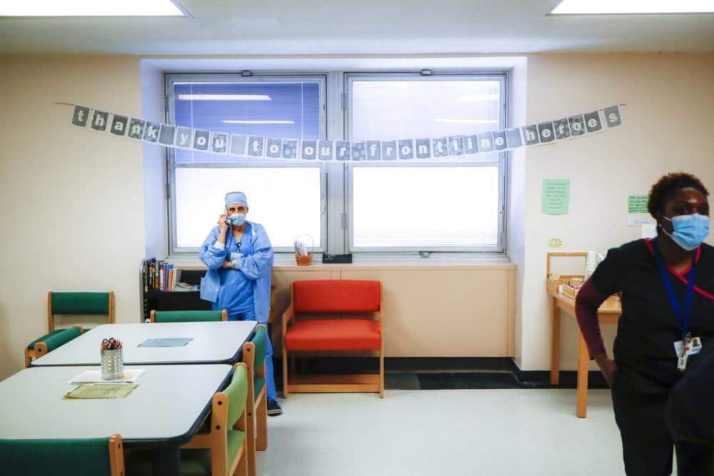 A medical worker takes a break in the employee respite facility at NYC Health + Hospitals Metropolitan, Wednesday, May 27, 2020, in New York. (John Minchillo/AP)