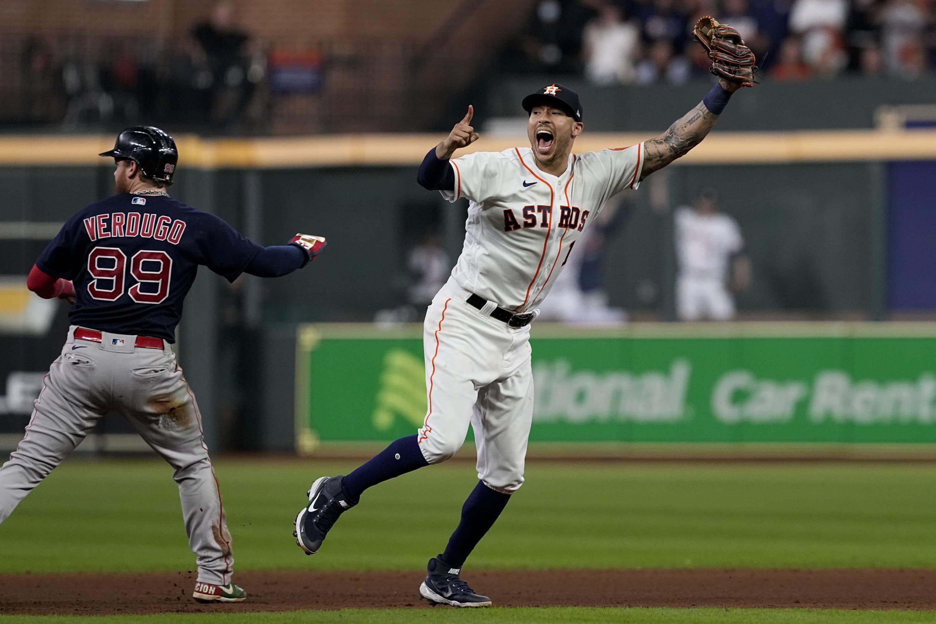 Houston Astros shortstop Carlos Correa celebrates after tagging out Boston Red Sox's Alex Verdugo at second to end the top of the seventh inning. (Tony Gutierrez/AP)