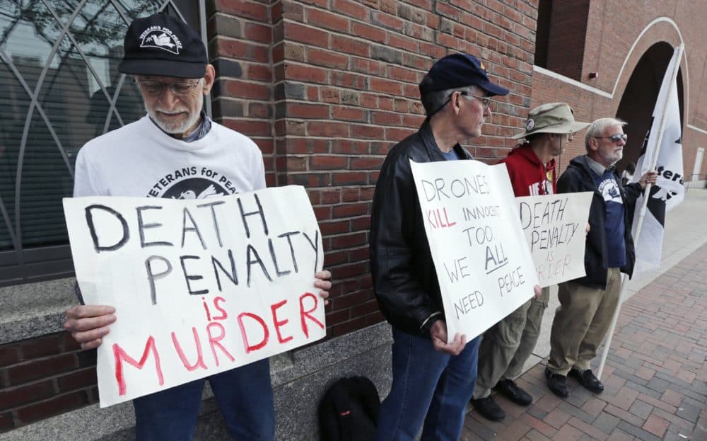 A group from "Veterans for Peace" picketed outside the Moakley Federal Courthouse as jurors deliberated in the penalty phase of the trial of Boston Marathon bomber Dzhokhar Tsarnaev, Friday, May 15, 2015. (Charles Krupa/AP)