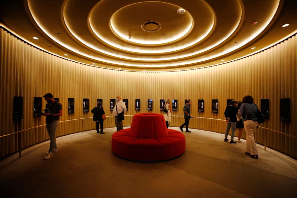Visitors walk through the Academy History exhibit with historic Oscar statuettes in the Academy Museum of Motion Pictures on Sept. 30, 2021, in Los Angeles, CA. (Al Seib/Los Angeles Times via Getty Images)
