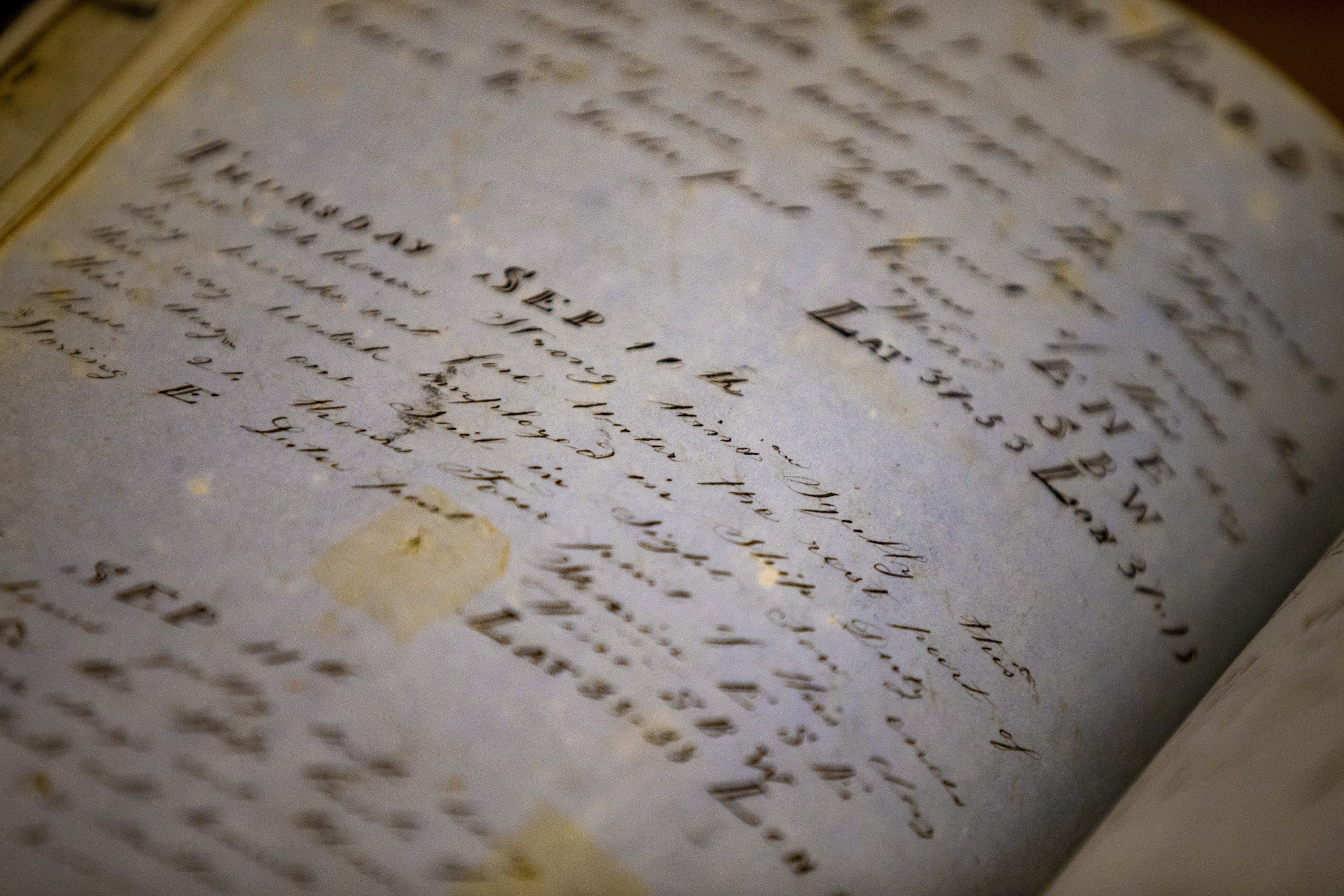 Entries in the log book of the brig Thomas Winslow from 1846-1847 at the Providence Public Library, which owns one of the five largest collections of whaling log books in the country. (Jesse Costa/WBUR)