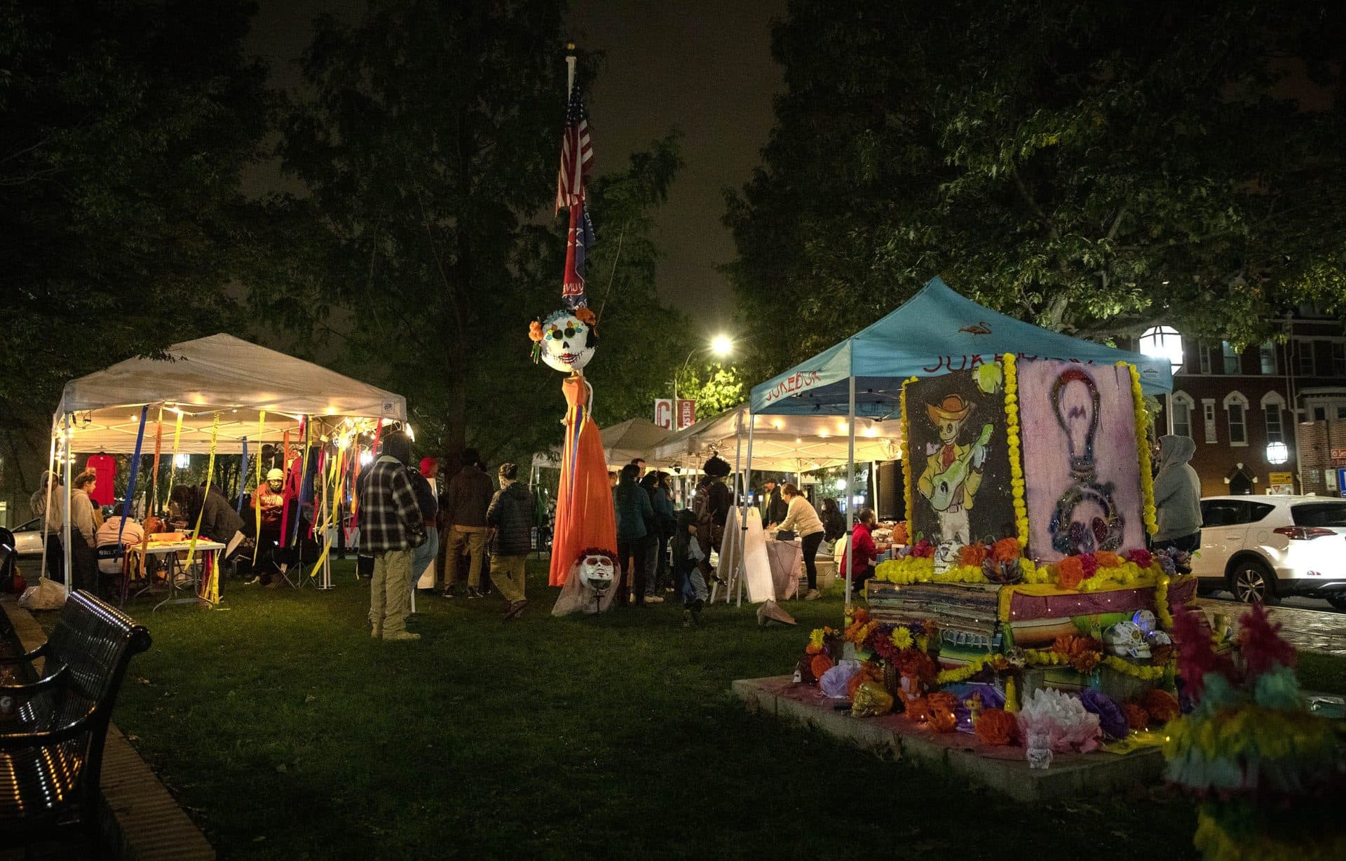 People gathered in Winnisimmet Park, Chelsea, for a mini-festival in honor of Día del los Muertos. (Robin Lubbock/WBUR)