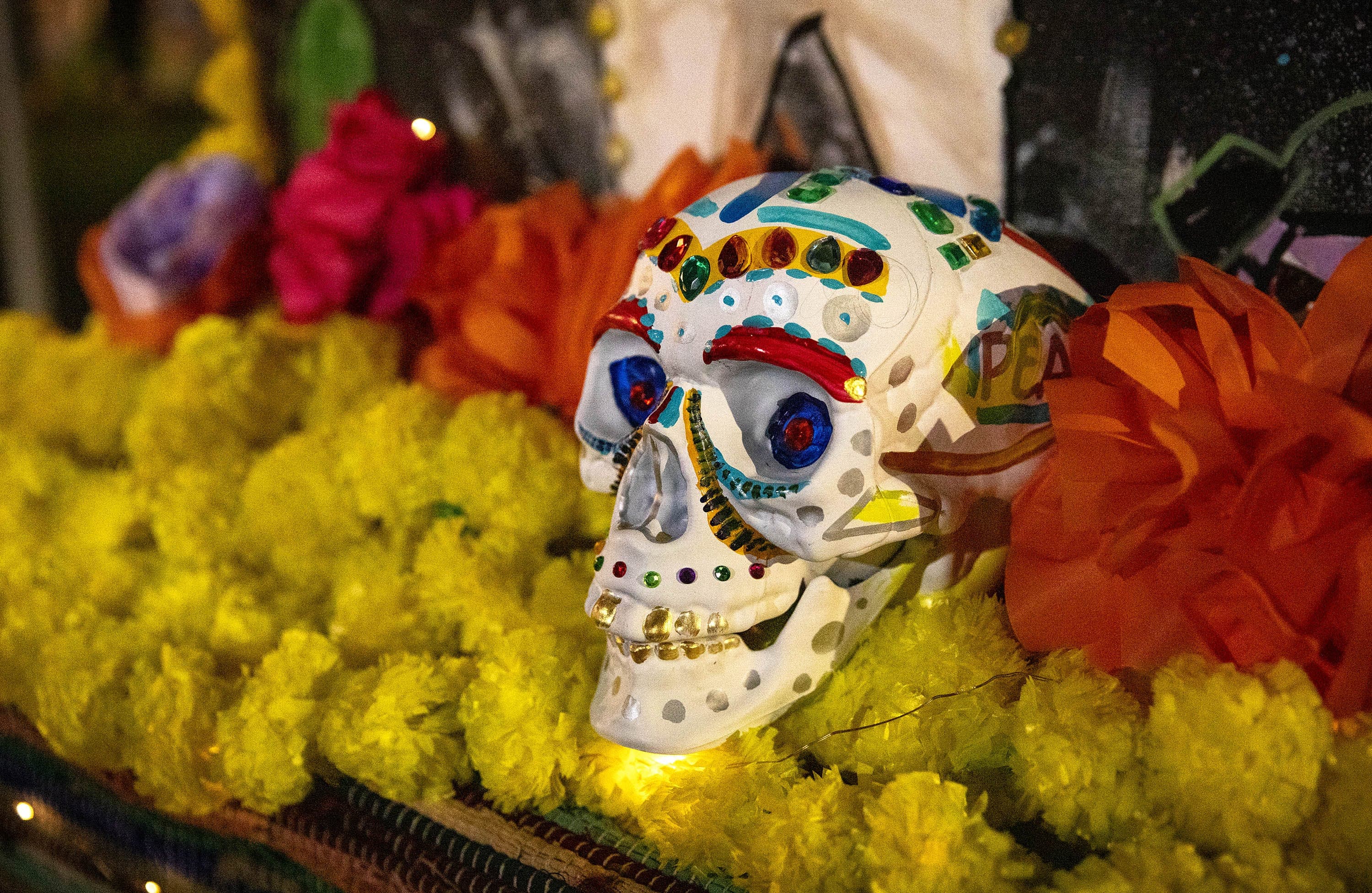 A calavera adorning the ofrenda in honor of Dia del los Muertos at Winnisimmet Park in Chelsea. (Robin Lubbock/WBUR)