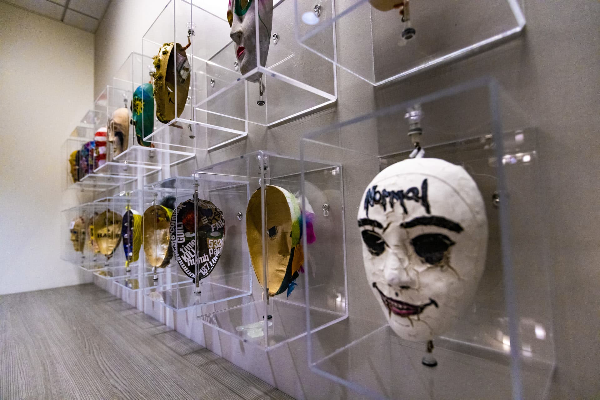 Home Base has an art therapy program in which veterans paint masks. The outside of the mask represents how they project themselves to the world; the inside represents what they're really feeling. (Jesse Costa/WBUR)