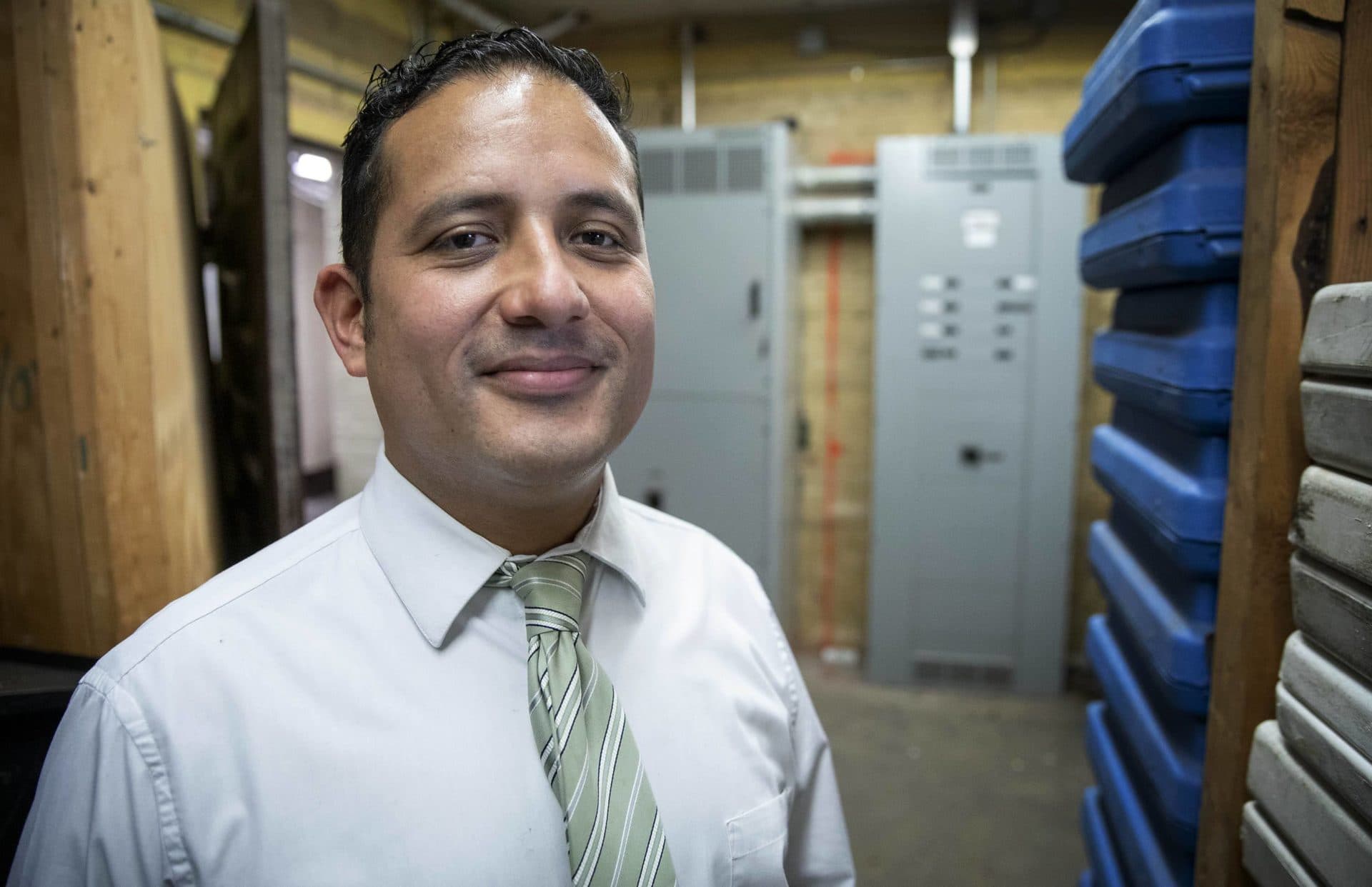 Chelsea Commissioner of Public Works Fidel Maltez in the switching room in the basement of City Hall. (Robin Lubbock/WBUR)