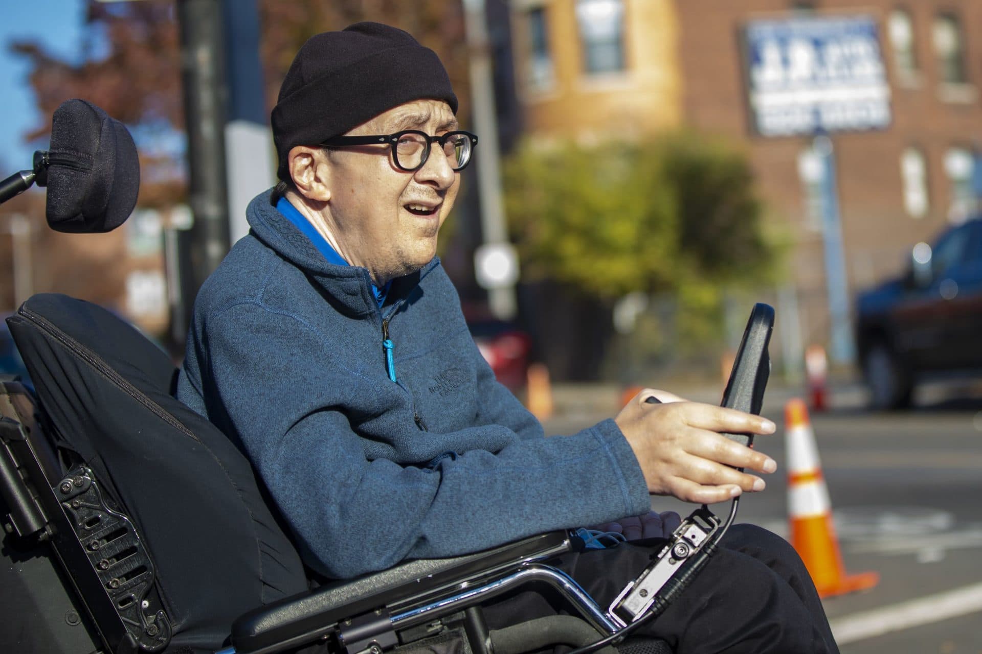 Michael Muehe looks to cross Washington Street in Jamaica Plain. (Jesse Costa/WBUR)