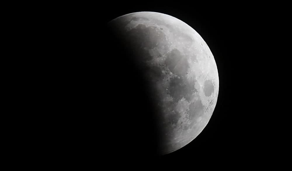 The eclipse of the moon progresses on May 26, 2021, in Santa Monica, California, on its way to the "Super Blood Moon" total eclipse. (Frederic J. Brown/AFP/Getty Images)