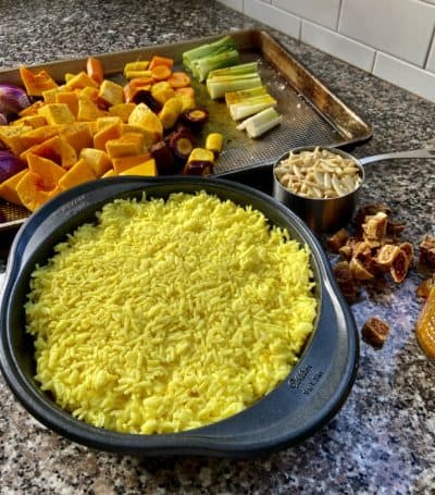 Preparing the vegan jeweled rice with roasted vegetables. (Kathy Gunst/Here & Now)