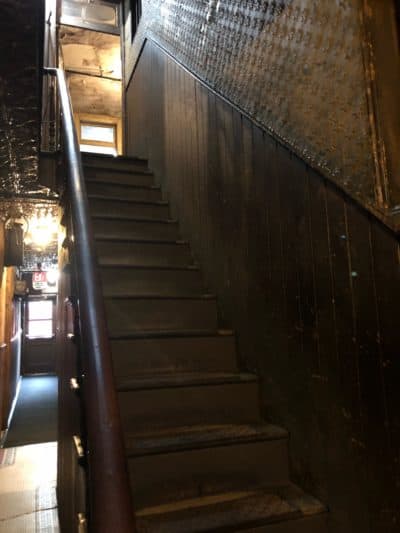 Steep narrow hallways characterize the Tenement building. (Robin Young/Here & Now)
