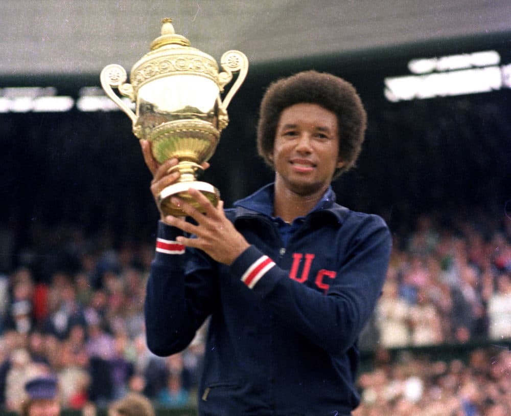 Arthur Ashe holds his Wimbledon trophy cup after defeating fellow American Jimmy Connors in the final match of the men's singles championship at the All England Lawn Tennis Championship at Wimbledon in London in 1975. (Photo by Uncredited/AP/Shutterstock)