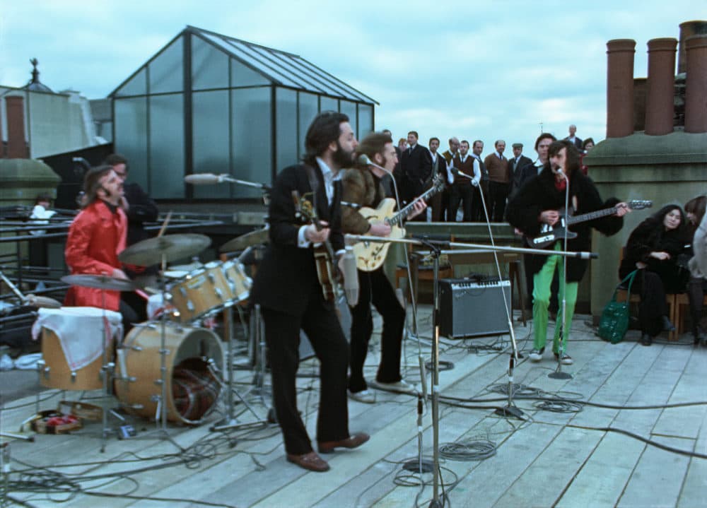 A still of the rooftop performance in "The Beatles: Get Back." (Courtesy of Apple Corps Ltd.)
