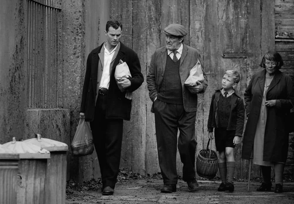 Left to right: Jamie Dornan, Ciarán Hinds, Jude Hill and Judi Dench in director Kenneth Branagh's "Belfast." (Courtesy Rob Youngson/Focus Features)