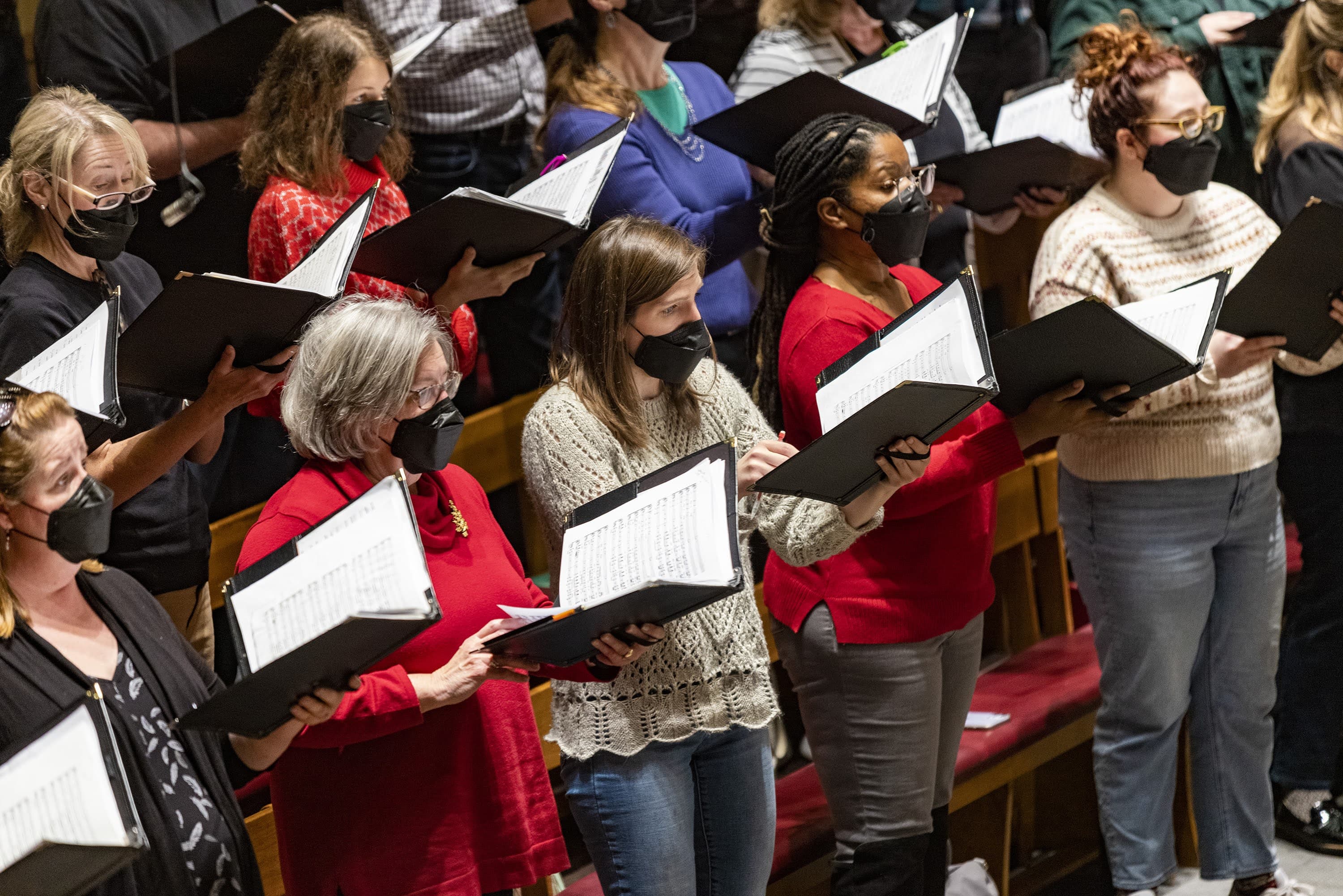 The Tanglewood chorus rehearses at Symphony Hall for the 2021 Holiday Pops concerts. (Jesse Costa/WBUR)
