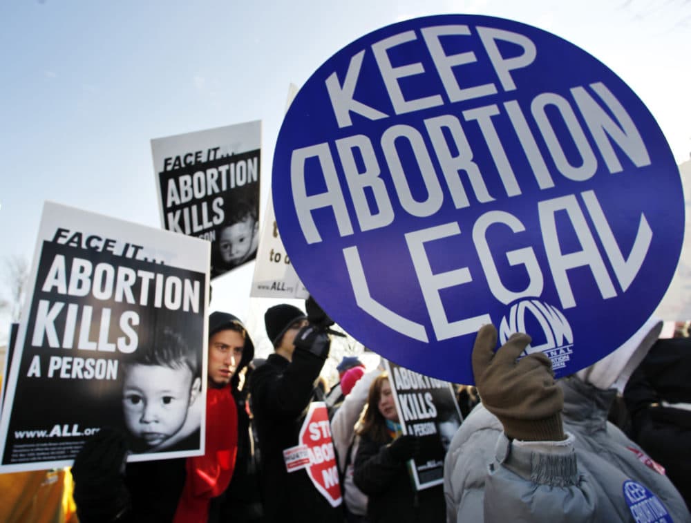 Anti-abortion and pro-choice activists stand next to each other in front of the U.S. Supreme Court in Washington, D.C. (Manuel Balce Ceneta)
