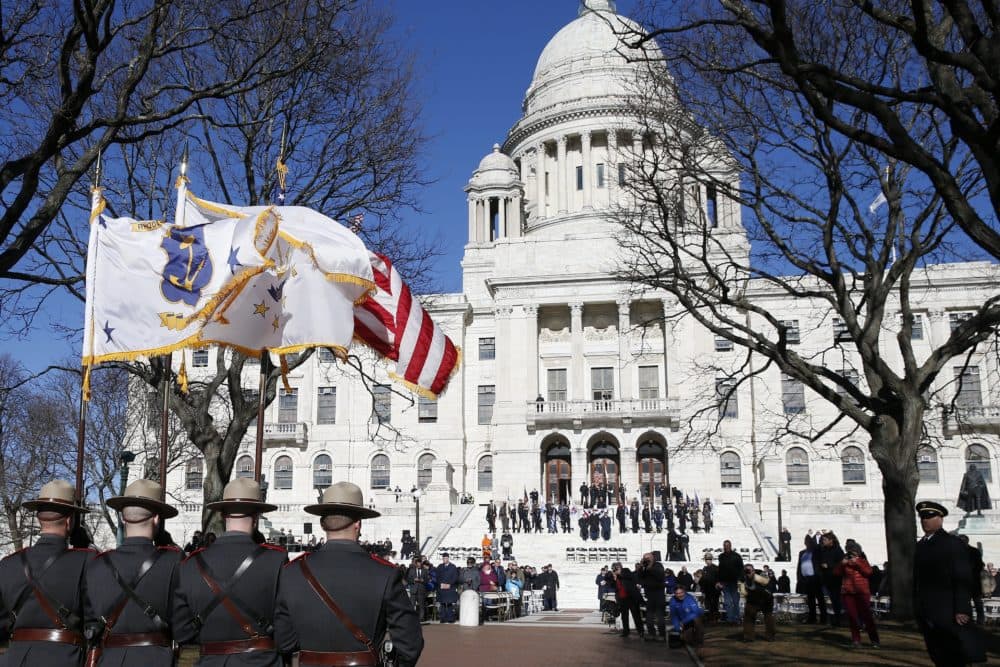 Members of the Rhode Island State Police lead the inauguration procession at the State House in Providence, R.I., Tuesday, Jan. 1, 2019. (AP Photo/Michael Dwyer)
