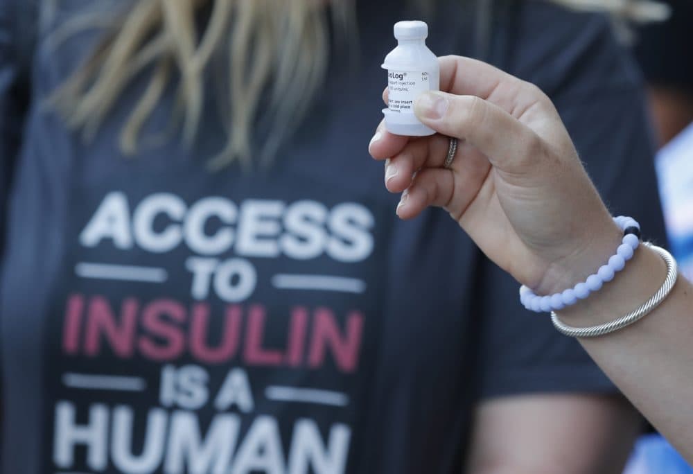 A patient holds a vial of insulin during a news conference in Windsor, Ont. Sen. Bernie Sanders, I-Vt., and a busload of insulin patients stopped in Windsor to purchase the drug to highlight the high costs of the insulin in the United States. (Carlos Osorio/AP)