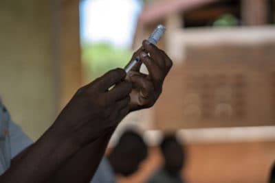 Health authorities prepare to vaccinate residents of the village of Tomali in Malawi, where young children will be test subjects for the world's first malaria vaccine on December 11, 2019. (Jerome Delay / AP / File)