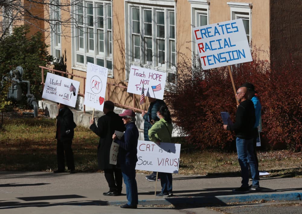 People protest outside the offices of the New Mexico Public Education Department's office in Albuquerque, New Mexico. Supporters say the new curriculum, which includes ethnic studies, is "anti-racist." (Cedar Attanasio/AP Photo)