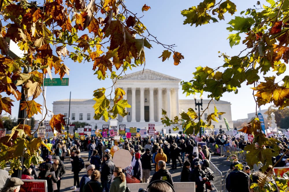 Abortion rights advocates and anti-abortion protesters demonstrate in front of the U.S. Supreme Court on Dec. 1, 2021, as the court hears arguments in a case from Mississippi, where a 2018 law would ban abortions after 15 weeks of pregnancy. (Andrew Harnik/AP)