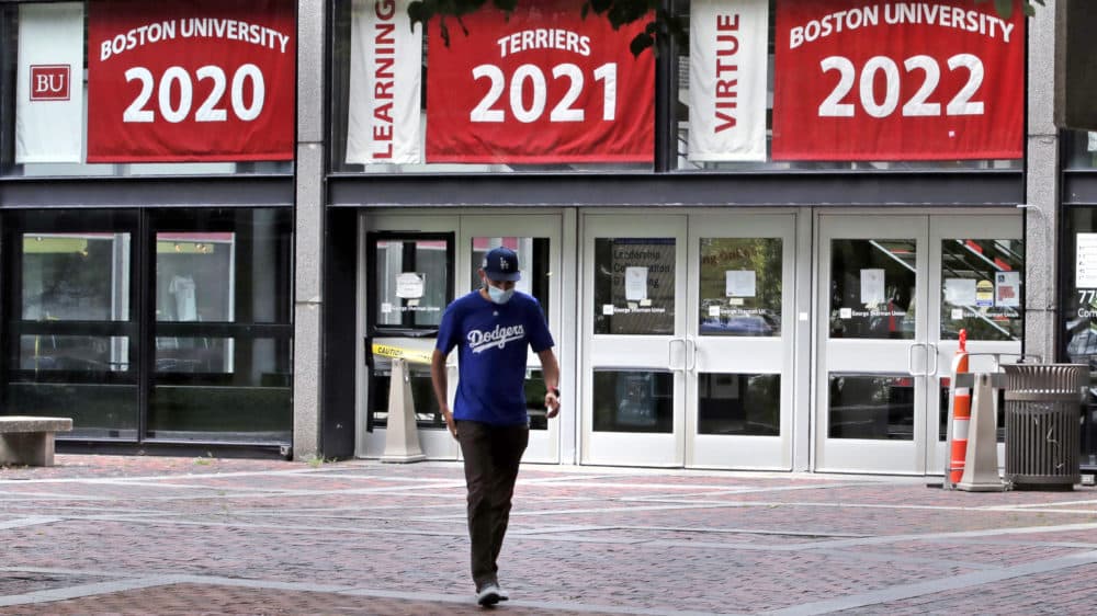 A graduate student leaves the Boston University student union building on July 23, 2020. (Charles Krupa/AP)