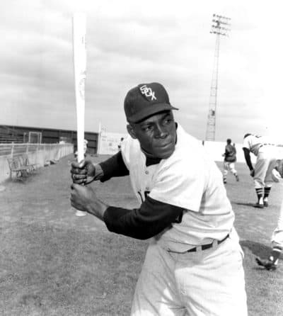 In a March 9, 1957, file photo, Chicago White Sox outfielder Orestes "Minnie" Miñoso poses in batting position at Al Lopez Field in Tampa, Fla. (AP/File)