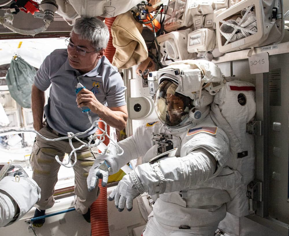 NASA astronaut Mark Vande Hei assists NASA spacewalker Thomas Marshburn in the U.S. Quest airlock before the beginning of a six-hour and 32-minute spacewalk to replace a faulty antenna system on the International Space Station's Port-1 truss structure. (NASA)