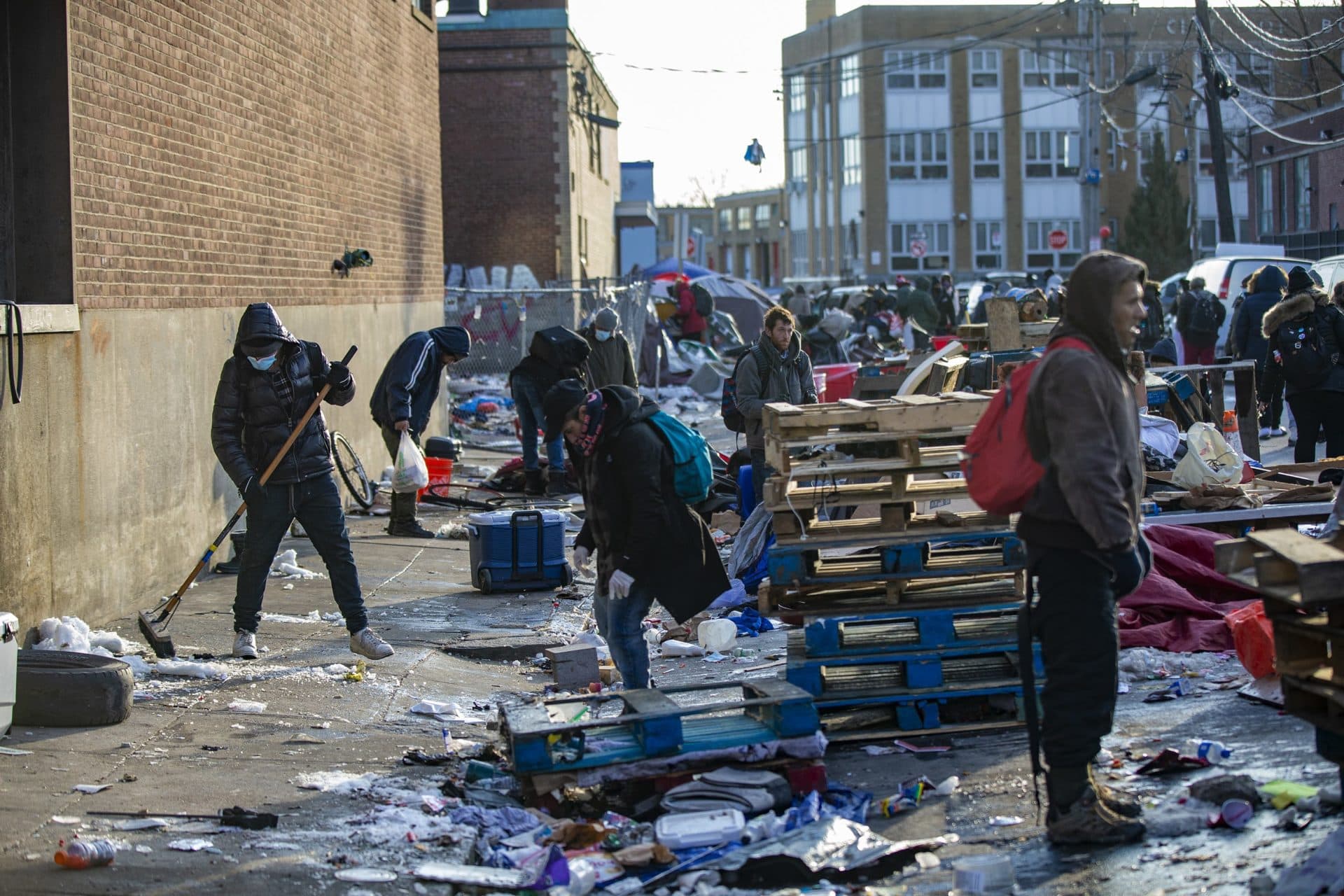 Workers begin to clean up Atkinson Street. (Jesse Costa/WBUR)
