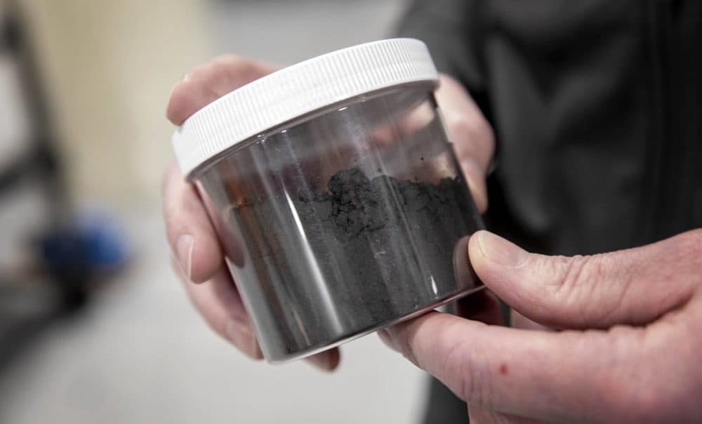 A container of &quot;black mass,&quot; made from ground-up lithium batteries, now ready for recycling. (Robin Lubbock/WBUR)