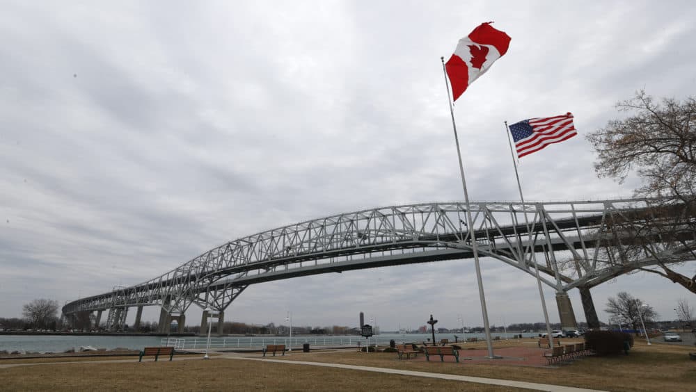Vehicles move across the Blue Water Bridge in Port Huron, Mich., to Sarnia, Ontario, Canada, on Wednesday, March 18, 2020. (Paul Sancya/AP)
