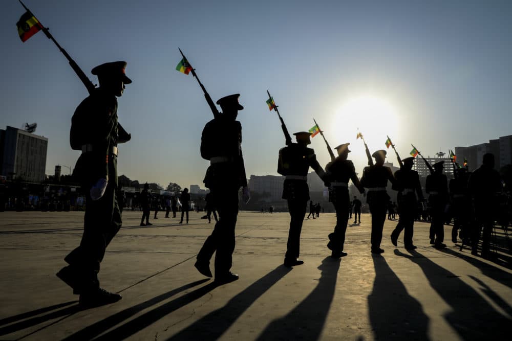 Ethiopian military parade with national flags attached to their rifles at a rally organized by local authorities to show support for the Ethiopian National Defense Force (ENDF) in downtown Addis Ababa, Ethiopia, on Nov. 7, 2021. (AP)