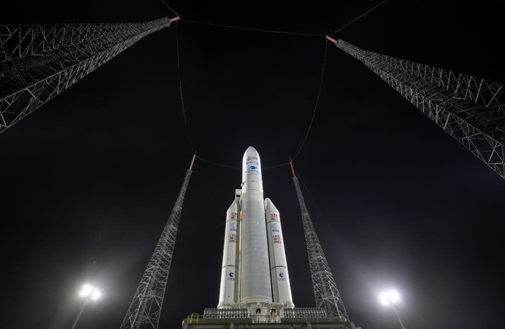 In this photo provided by NASA, Arianespace's Ariane 5 rocket with NASA's James Webb Space Telescope onboard, is seen at the launch pad on Dec. 23, 2021, at the Guiana Space Center in French Guiana. The James Webb Space Telescope has infrared vision, allowing it to peer deeper into the universe, all the way to the first stars and galaxies. (Bill Ingalls/NASA via AP)