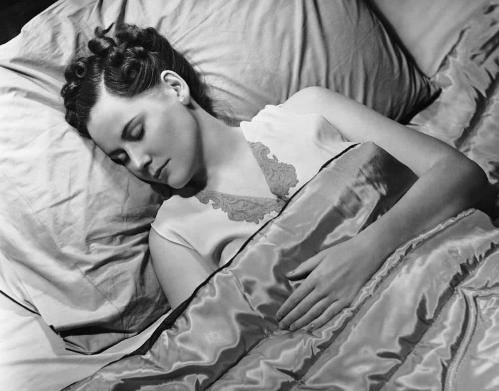Sleeping woman in bed circa the 1950s. (George Marks/Retrofile/Getty Images)