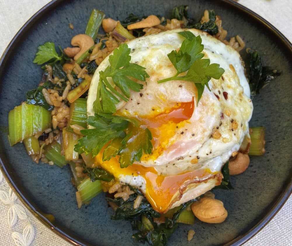 Stir-fried rice with vegetables and fried egg Kathy Gunst/Here & Now)