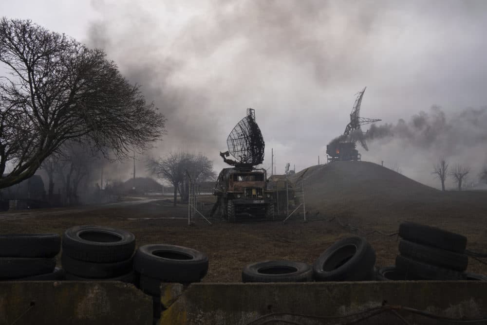 Smoke rises from an air defense base in the aftermath of an apparent Russian strike in Mariupol, Ukraine, Thursday, Feb. 24. (Evgeniy Maloletka/AP)