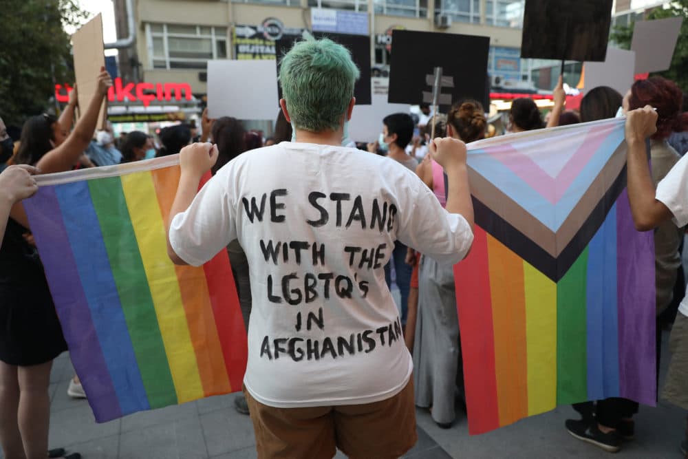 Members of the Turkish LGBTQ+ community hold rainbow flags during a solidarity protest action to support Afghan women in Ankara on Aug. 25, 2021. (Adem Altan/AFP via Getty Images)