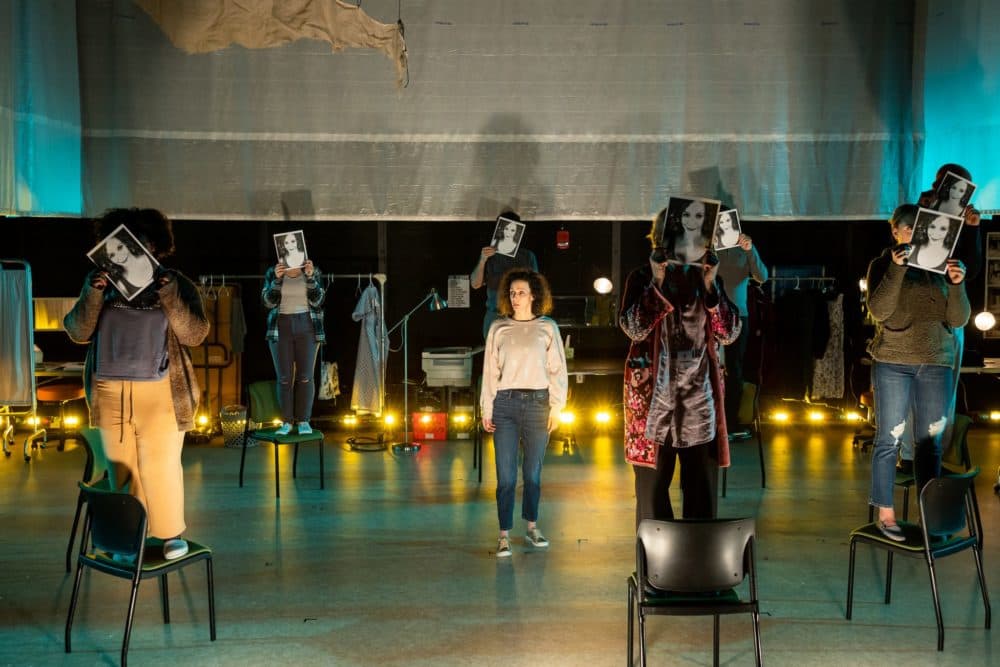 The cast of "People, Places & Things" holding paper faces of Emma (Marianna Bassham). (Courtesy Nile Scott Studios)