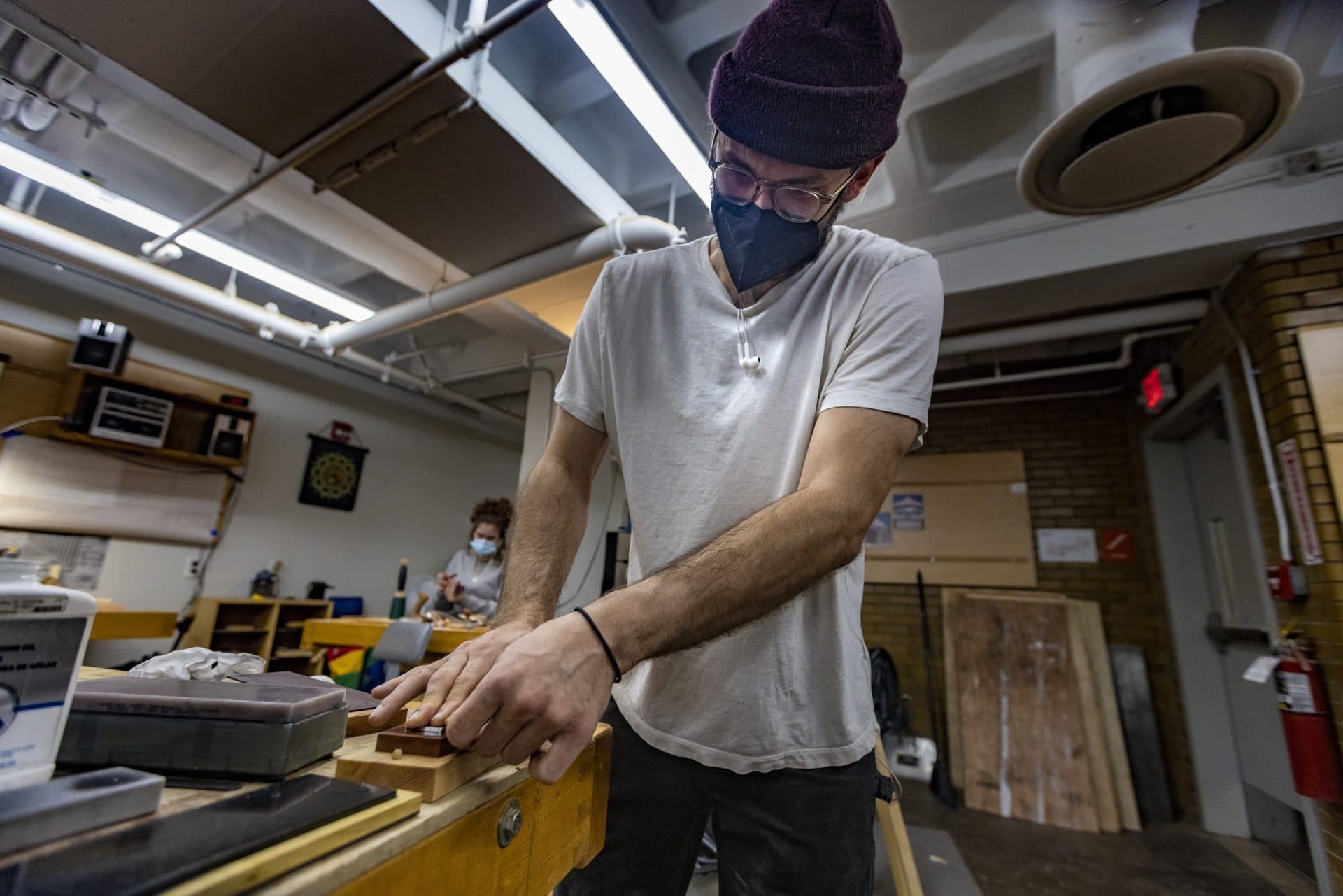 David Clarke sharpens the blade of a shoulder plane in the Bench Room at North Bennet Street School. Clarke hopes to start fresh as a woodworker after spending years in the restaurant industry. (Jesse Costa/WBUR)