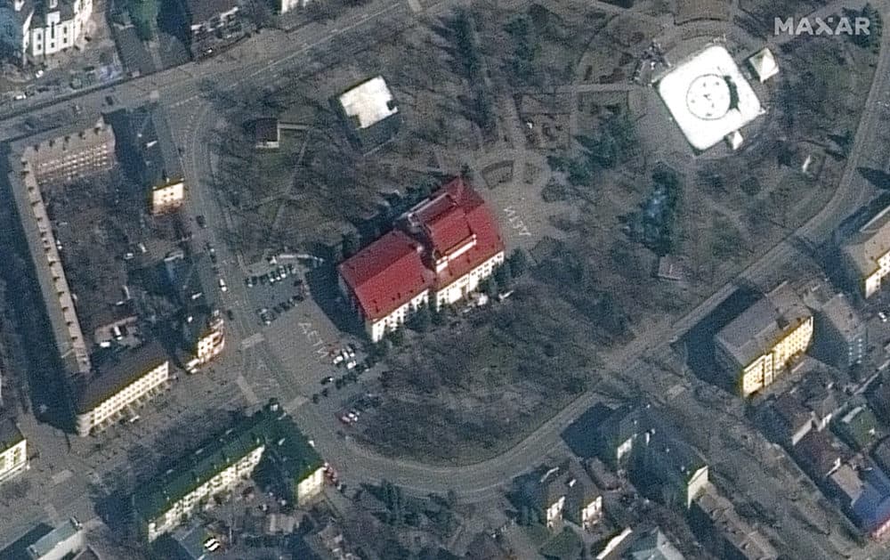 Satellite imagery of Mariupol, Ukraine, on March 14 showing the Mariupol Drama Theater which was bombed on March 16. The building had been used as a shelter for hundreds of Ukrainian civilians.  Notably, on the March 14 satellite imagery, the word "children" is written in large white letters (in Russian) in front of and behind the theater. (Satellite image/Maxar Technologies via Getty Images)