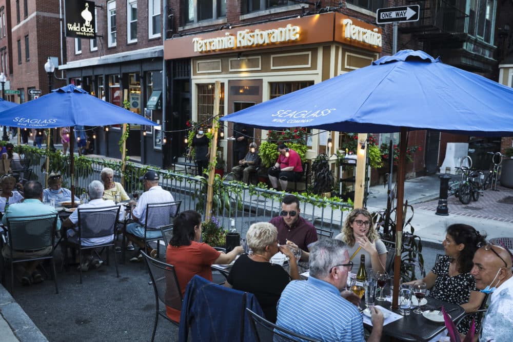 Restaurant-goers enjoy dinner on an outdoor patio at Terramia Ristorante in Boston's North End on Sept. 4, 2020. (Erin Clark/The Boston Globe via Getty Images)