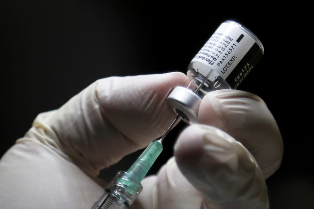 A healthcare worker prepares to administer a Pfizer/BioNTEch coronavirus vaccine (Carlos Osorio/POOL/AFP via Getty Images)