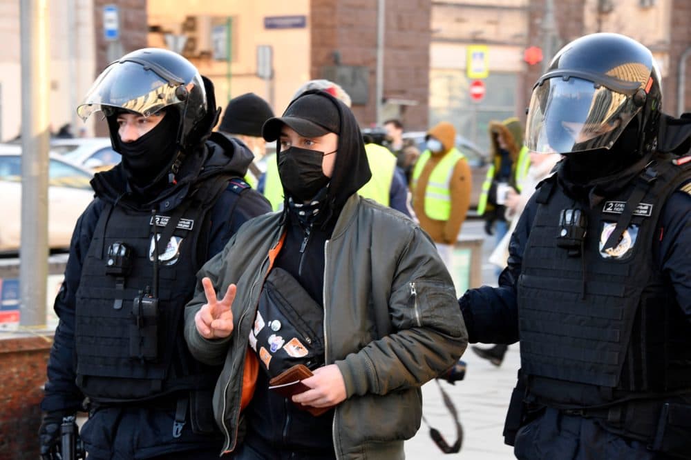 Police officers detain a man during a protest against Russia's invasion of Ukraine in central Moscow on February 27, 2022. (Alexander Nemenov/AFP via Getty Images)