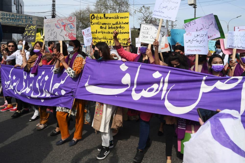 Aurat March activists hold placards during a demonstration to mark the International Women's Day in Lahore on March 8, 2022. (Arif Ali/AFP via Getty Images)